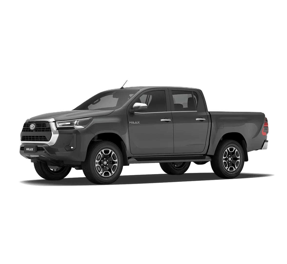Toyota Hilux gris con la trompa hacia la derecha